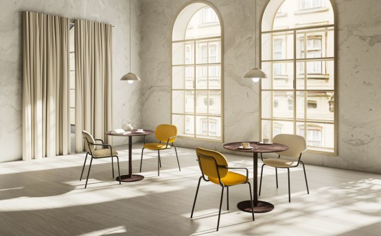 Two café tables and four armchairs in sand and yellow-colored fabrics and with black metal frame. 