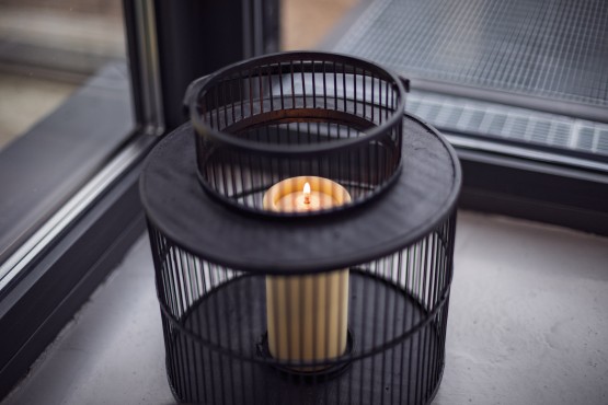 Black Lantern with Candle in Ivory Color. Can be used as decocations in hotel or restaurant. 