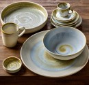 Mugs, Cups, Bowls and Plates for restaurants and cafés placed on a rustic wooden table