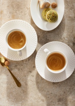 Two cup of coffee served in white cups on white saucers. For café or restaurant. 