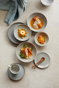 Bowls, plates and cups on beige and light blue colors. For hotels and cafés.
