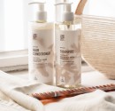 Two bottles with “Ecolabel” certified cosmetics for hotels