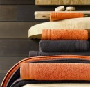 Hotel Towels in different sizes in Brown and Orange.